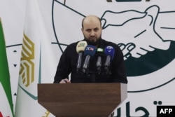 FILE - Mohammed Bashir holds a press conference in the rebel-held northwestern Syrian city of Idlib on Nov. 28, 2024. The Syrian rebels now in power in Damascus appointed Mohammed al-Bashir as head of a transitional government, state media said on Dec. 10, 2024.
