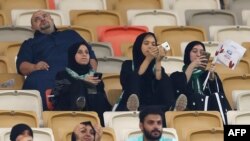 Female supporters of Al-Ahli get the chance to cheer on their team from inside a formerly men-only stadium in Jeddah for the first time. (AFP)
