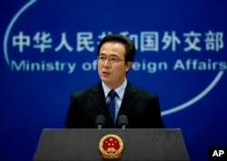 FILE - Chinese Foreign Ministry spokesman Hong Lei speaks during a press briefing in Beijing.