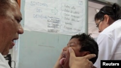 FILE - A dengue fever victim receives medical treatment at a health center in Managua, Oct. 31, 2013. Hemorrhagic dengue was responsible for 14 deaths in Nicaragua so far this year, with the number of cases confirmed at more than five thousand, according 