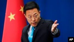 ژاو لیجان، سخنگوی وزارت خارجۀ چین گفت که امریکا باید از مداخله در امور داخلی چین دست بردارد