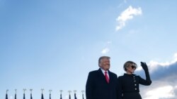 Outgoing U.S. President Donald Trump and first lady Melania Trump address guests at Joint Base Andrews in Maryland, Jan. 20, 2021.