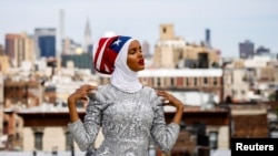 Fashion model and former refugee Halima Aden, who is breaking boundaries as the first hijab wearing model gracing magazine covers and walking in high profile runway shows poses during a shoot at a studio in New York City, U.S .August 28, 2017.