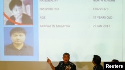Malaysia's Royal Police Chief Khalid Abu Bakar (C) speaks next to a screen showing North Korean Kim Uk Il during a news conference regarding the apparent assassination of Kim Jong Nam, the half-brother of the North Korean leader. (REUTERS/Athit Perawongmetha)
