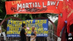 Filipino activists protest near the Malacanang Presidential Palace in Manila, Philippines, July 20, 2017, against Philippine President Rodrigo Duterte's proposed extension of martial law in the whole of Mindanao island until the end of the year.