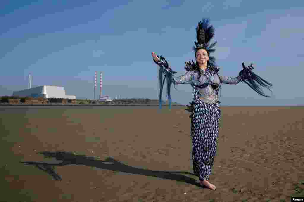 Winner of Junk Kouture world designer of the year Clodagh Ramsey, 17, from Wilso's Hospital School in County Westmeath, poses in her dress called 'Aquacultural,' an organic waste design she made from around 2,000 mussel shells championing sustainable food production,&nbsp;on Sandymount beach, in Dublin, Ireland.