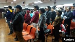 FILE - About 200 Catholics attend a prayer meeting for the Chinese Church after news emerge that Beijing and the Vatican have reached a deal on bishop appointments, in Hong Kong, China, Feb. 12, 2018.
