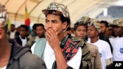 FILE - Youth joining the Ethiopian National Defense Force are escorted to Meskel Square in the capital Addis Ababa, Ethiopia, July 27, 2021. 