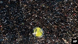 Demonstrators take part in a protest, June 3, 2020, in downtown Los Angeles, sparked by the death of George Floyd, who died May 25 after he was restrained by Minneapolis police. 