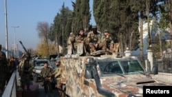 ဆီးရီးယားမြို့တော်ကို သူပုန်တွေက သိမ်းပိုက်ပြီး သမ္မတဘာရှာ အယ်လ်အာဆတ်ထွက်ပြေးသွားပြီးနောက် သူပုန်တိုက်ခိုက်ရေးသမားတွေကို ဒမတ်စကက်မြို့မှာ တွေ့ရစဥ်။ (ဒီဇင်ဘာ ၉၊ ၂၀၂၄)