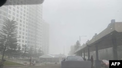 This handout photo courtesy of X (formerly Twitter) user @markymarksworld on September 22, 2023 shows smog from Taal Volcano hanging over Tagaytay city in Cavite Province.