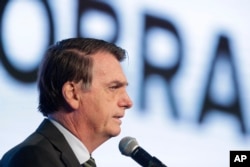 Brazil's President Jair Bolsonaro speaks at the opening of the Brazilian Steel Congress, in Brasilia, Brazil, Aug. 21, 2019.