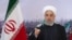 FILE - In this photo released by the official website of the office of the Iranian Presidency, President Hassan Rouhani addresses the nation in a televised speech in Tehran, Iran, Feb. 10, 2021.
