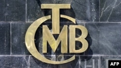 A picture taken on Aug. 14, 2018 shows the logo of Turkey's Central Bank (TCMB) at the entrance of the bank's headquarters in Ankara, Turkey.