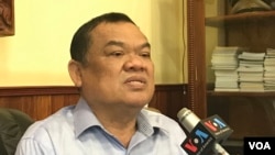 A mother and child holding flowers are stopped by police as they try to pay tribute to a man, who stabbed a policeman then stabbed himself and died on the anniversary of the city's return to Chinese rule, at Causeway Bay in Hong Kong, China.