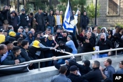 Right wing supporters of Israeli solider, Sgt. Elor Azaria, scuffle outside a Israeli military court in Tel Aviv, Israel, Jan. 4, 2017. Scuffles erupted outside the court during the proceedings.