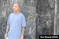 A deportee visits sites on Kirirom Mountain with Zin, a tour company founded last year by five deportees.