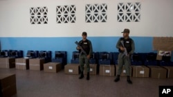 Venezuelan Bolivarian National Guard officers guard voting machines at a polling station, in Caracas, Venezuela, May 18, 2018.