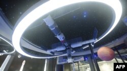 FILE - A model of China's Tiangong space station is seen at the Apsara Conference, a cloud computing and artificial intelligence (AI) conference, in Hangzhou, in China's eastern Zhejiang province, Oct. 19, 2021.