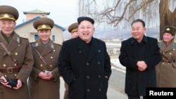 North Korean leader Kim Jong Un, center, in an undated photo released by North Korea.