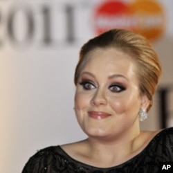 Singer Adele arrives at the Brit Awards in London