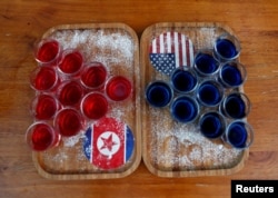 Special red and blue shots offered at Escobar bar to mark the summit meeting between U.S. President Donald Trump and North Korean leader Kim Jong Un, are displayed on a table in Singapore June 4, 2018. REUTERS/Edgar Su TPX IMAGES OF THE DAY - RC150341
