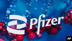 FILE - This Feb. 5, 2021, file photo shows the Pfizer logo displayed at the company's headquarters in New York.