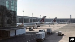 Qatar Airways planes are seen parked at the Hamad International Airport in Doha, Qatar, June 16, 2017. 