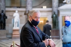 President Donald Trump's Chief of Staff Mark Meadows arrives on Capitol Hill in Washington, July 29, 2020, ahead of a meeting with lawmakers on a new coronavirus stimulus bill.
