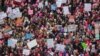 Protesters gather near the U.S. Capitol in Washington D.C. for the Women' March, Jan. 21, 2017. (Photo: B. Allen / VOA) 