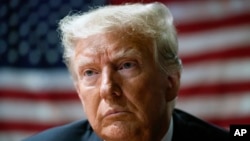 FILE - Former President Donald Trump attends an event with supporters at the Westside Conservative Breakfast, in Des Moines, Iowa, Thursday, June 1, 2023. (AP Photo/Charlie Neibergall, File)