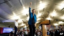 Democratic presidential candidate Sen. Elizabeth Warren of Massachusetts acknowledges supporters at a primary election night rally, Feb. 11, 2020, in Manchester, N.H.