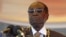 FILE: President Robert Mugabe waits to address crowds gathered for Zimbabwe's Heroes Day commemorations in Harare, August 10, 2015.