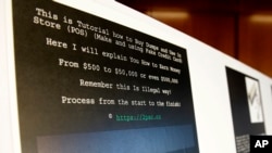 A screenshot of a tutorial posted online by Russian hacker Roman Seleznev on how to steal credit card data is displayed for reporters Friday on April 21, 2017, in Seattle. (Ted Warren/AP)