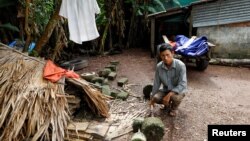 JB Nguyen Dinh Gia shows a barbell which was used by his son Joseph Nguyen Dinh Luyen, a suspected victim of 39 deaths in a truck container in UK, at home in Ha Tinh province, Vietnam October 27, 2019. (REUTERS/Kham)