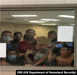 Figure 6. Eighty-eight adult males held in a cell with a maximum capacity of 41, some signaling prolonged detention to OIG Staff, observed by OIG on June 12, 2019, at Border Patrol’s Fort Brown Station.