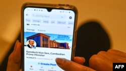 This photo illustration shows a post on Facebook by Cambodian government official Duong Dara, which includes an image of the official Facebook page of Cambodia's Prime Minister Hun Sen before he deleted his account, in Phnom Penh on June 30, 2023.