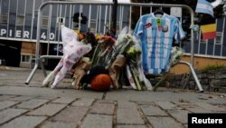 An Argentinian national team jersey hangs at a memorial on West Street two days after a man driving a rented pickup truck mowed down pedestrians and cyclists on a bike path alongside the Hudson River, in New York, Nov. 2, 2017. 