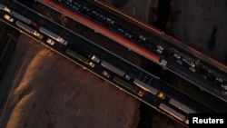 FILE - A drone view shows trucks waiting in line at the Zaragoza-Ysleta border crossing bridge to cross into the US, in Ciudad Juarez, Mexico, Nov. 26, 2024.