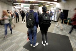 In this November 14, 2019, photo, students walk on the campus of Utah Valley University, in Orem, Utah.
