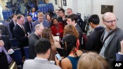 Reporters line up in hopes of attending a briefing in Press Secretary Sean Spicer's office at the White House in Washington, Feb. 24, 2017. White House held an off camera briefing in Spicer's office, where they selected who could attend.