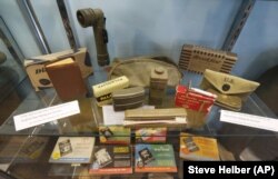 In this May 6, 2019, photo, military gear is on display at a tribute center for the Bedford Boys in Bedford, Virginia. The 75th anniversary of the D-Day invasion of Normandy has a solemn significance for Bedford, who lost 20 local men.