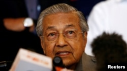 FILE - Mahathir Mohamad speaks during a news conference, Malaysia, May 10, 2018.