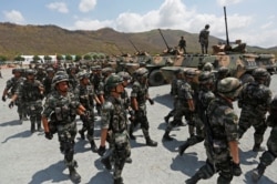 រូបឯកសារ៖ យោធាកម្ពុជានិងចិនចូលរួមសមយុទ្ធរួម «នាគមាសឆ្នាំ២០១៨» នៅខេត្តកំពង់ស្ពឺ កាលពីថ្ងៃទី១៧ ខែមីនា ឆ្នាំ២០១៨។