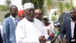 FILE - Nigerian presidential candidate Atiku Abubakar of the People's Democratic Party, speaks to journalists at his residence in Yola, Nigeria, Feb. 16, 2019.