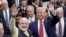 FILE - Indian Prime Minister Narendra Modi and U.S. President Donald Trump walk the perimeter of the arena floor to greet attendants after Modi's speech during the "Howdi Modi" event on Sept. 22, 2019, at NRG Stadium in Houston, Texas.