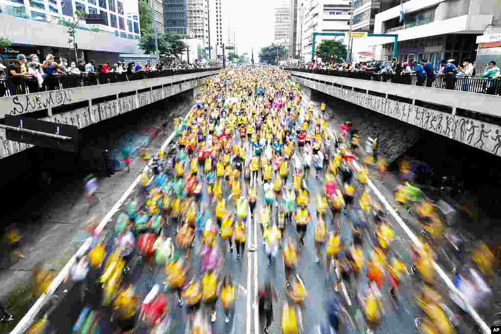 Runners compete in the Sao Silvestre international race in Sao Paulo, Brazil. The 15-kilometer race held annually on New Year's Eve, suspended in 2020 due to the coronavirus pandemic, was closed the public as a safety precaution but all runners were fully vaccinated.