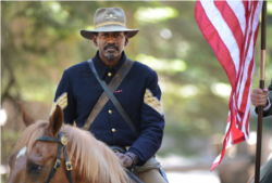 FILE - Shelton Johnson, park ranger at Yosemite National Park in California, in costume as a Buffalo Soldier. (Craig Kohlruss, The Fresno Bee/Associated Press)