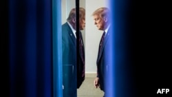 FILE - US President Donald Trump arrives to speak at the press briefing at the White House in Washington, DC, on July 30, 2020.