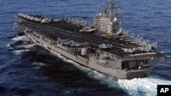 U.S. Nimitz-class aircraft carrier, USS Ronald Reagan, sails in the Pacific Ocean March 12, 2011 to Japan to render humanitarian assistance and disaster relief. (File photo - US Navy - Dylan McCord)